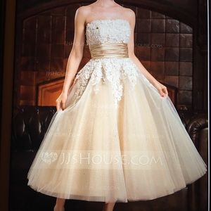 Strapless lace, tulle, corset and beaded gown.